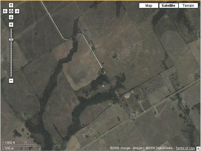 google satellite view of a typical white limestone gravel backroad in central Texas
